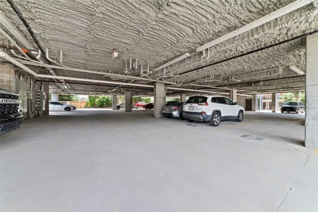 a tall buildings with yard in front of it