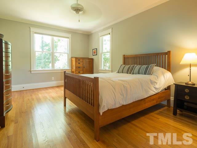 115 Hudson Street Raleigh, NC 27608 - Photo 14 of 25 a bedroom with a bed and window
