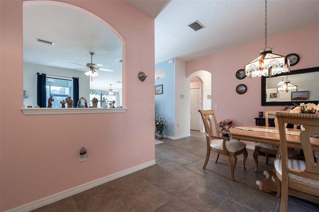 15969 Southwest 14th Avenue Road Ocala, FL 34473 - Photo 8 of 46 a view of a dining room with furniture