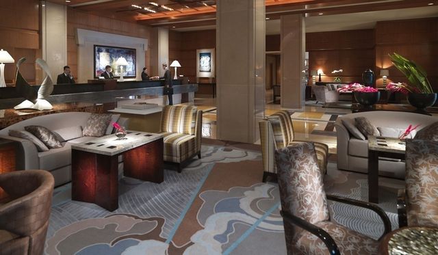 a living room with furniture a lamp and a fireplace