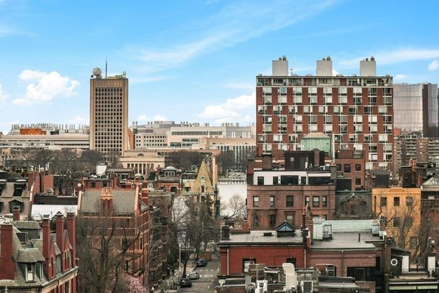 a view of a city with tall buildings