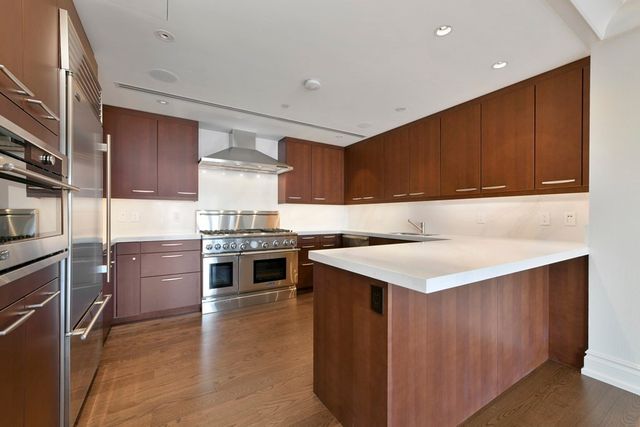 a kitchen with a stove and a sink