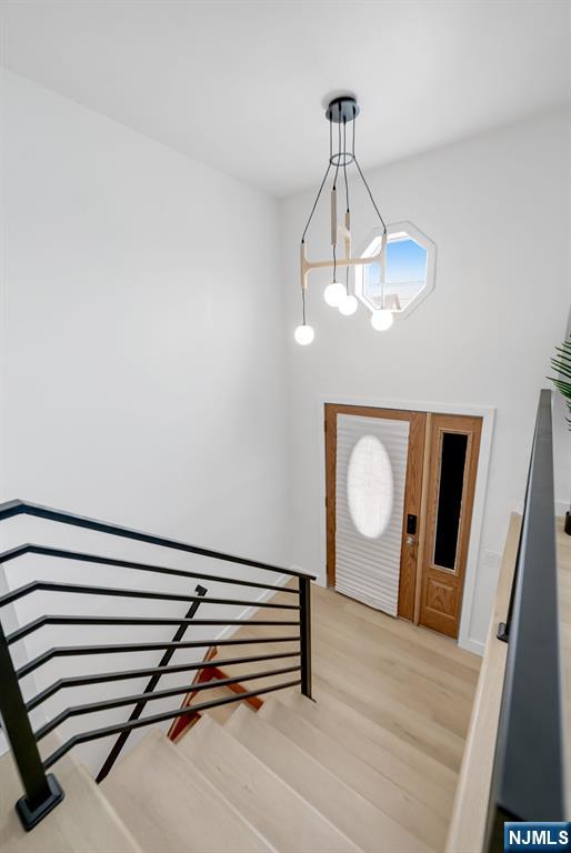 123 Chestnut Street Garfield, NJ 07026 - Photo 15 of 27 a view of a hallway with wooden floor and staircase