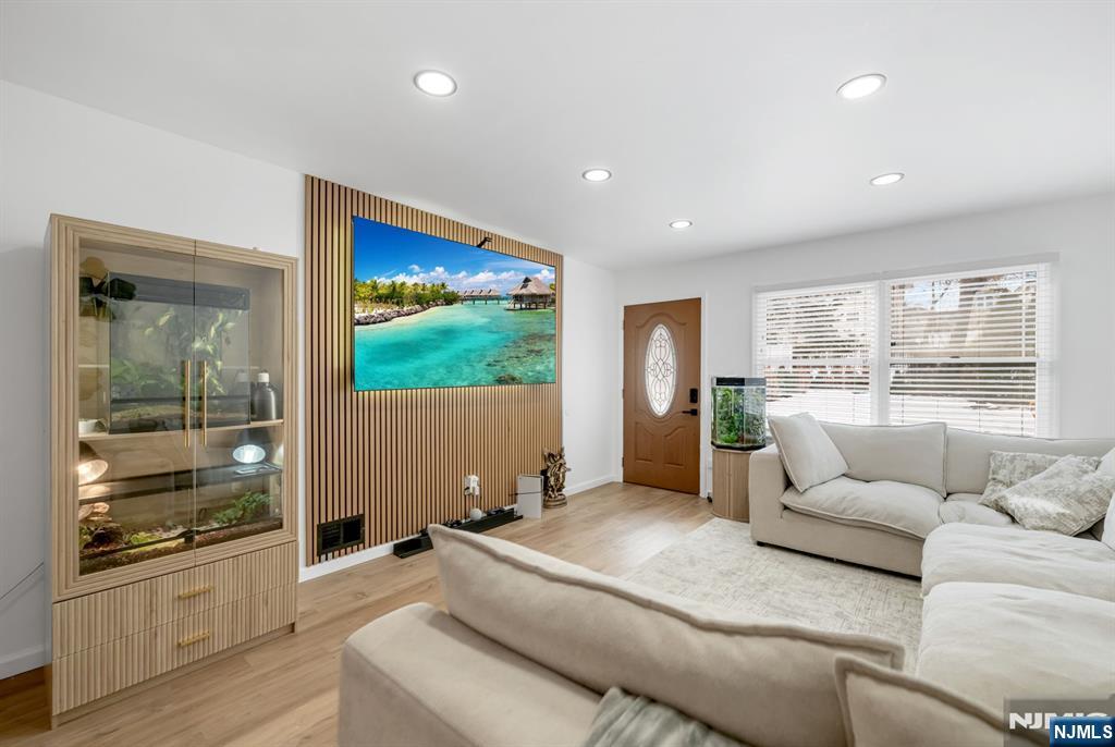 123 Chestnut Street Garfield, NJ 07026 - Photo 16 of 27 a living room with furniture and a large window