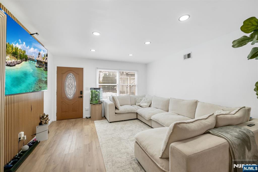 123 Chestnut Street Garfield, NJ 07026 - Photo 17 of 27 a living room with furniture and a couch