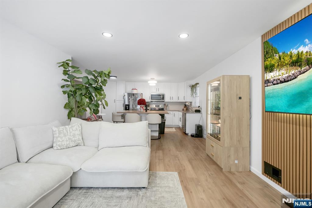 123 Chestnut Street Garfield, NJ 07026 - Photo 18 of 27 a living room with furniture and a flat screen tv