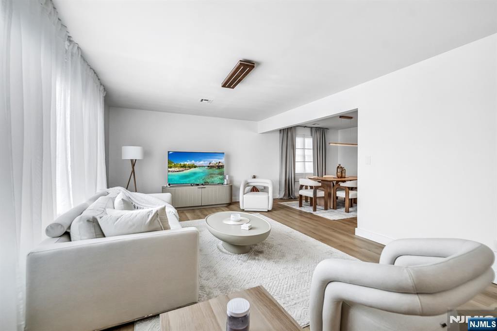 123 Chestnut Street Garfield, NJ 07026 - Photo 2 of 27 a living room with furniture and a large window