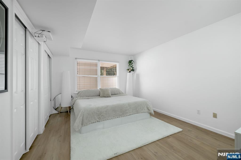 123 Chestnut Street Garfield, NJ 07026 - Photo 22 of 27 a bedroom with a bed and a window