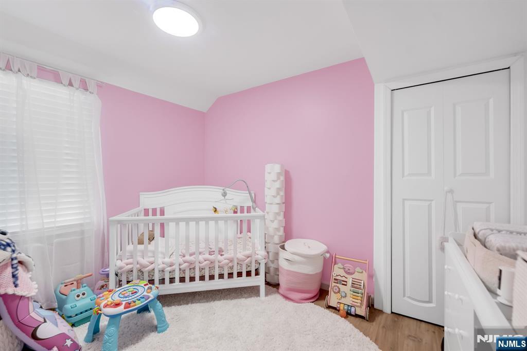 123 Chestnut Street Garfield, NJ 07026 - Photo 24 of 27 a bedroom with furniture and a baby crib