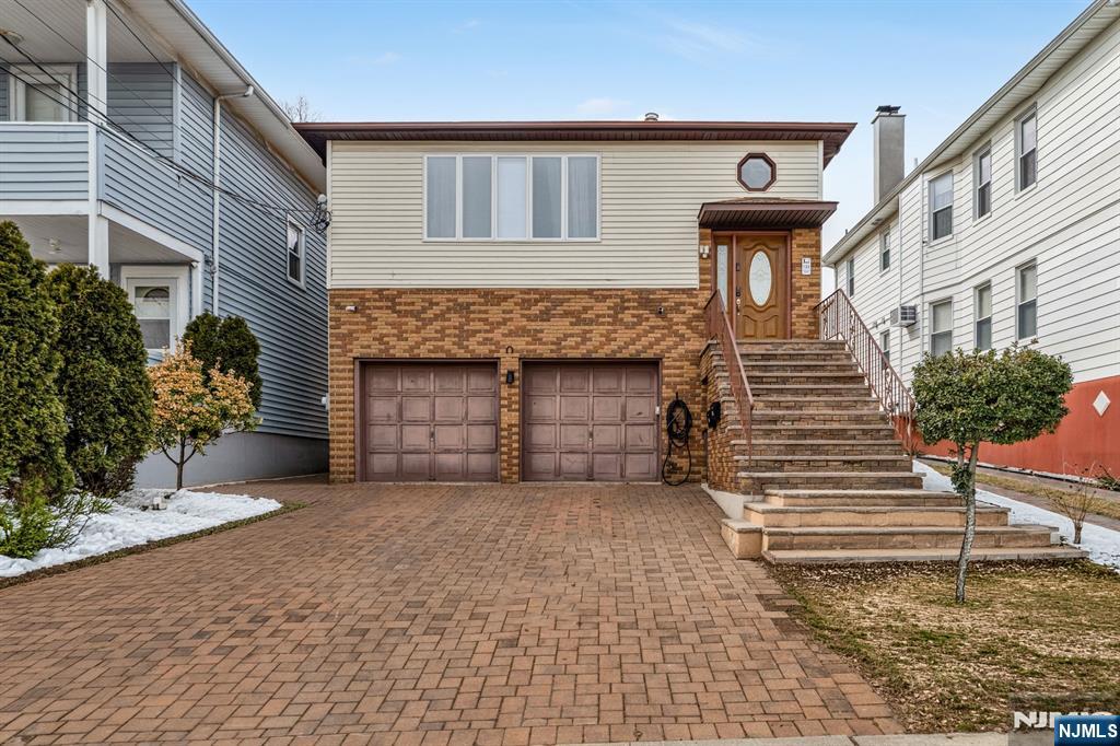 123 Chestnut Street Garfield, NJ 07026 - Photo 27 of 27 a front view of a house with a yard