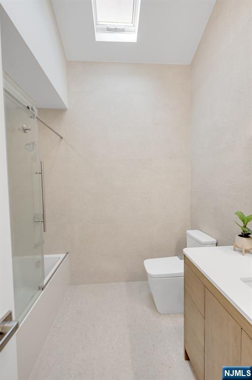 123 Chestnut Street Garfield, NJ 07026 - Photo 8 of 27 a bathroom with a sink a toilet and shower