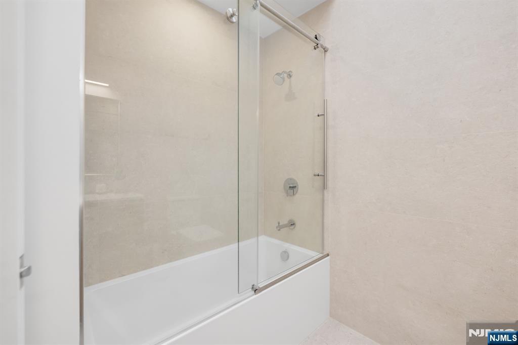 123 Chestnut Street Garfield, NJ 07026 - Photo 10 of 27 a bathroom with a bathtub and a shower