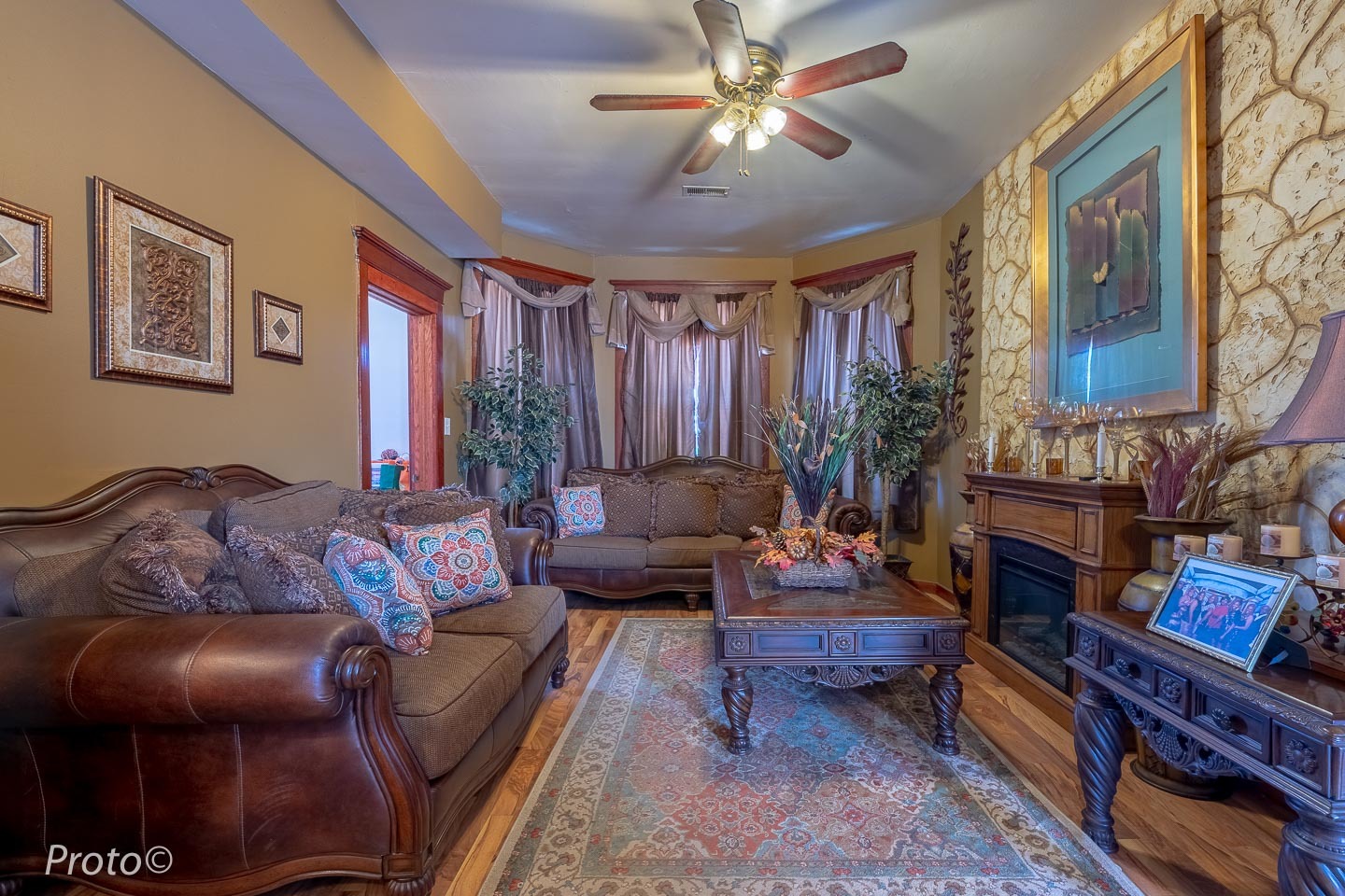 3605 West Cermak Road Chicago, IL 60623 - Photo 2 of 41 a living room with furniture a fireplace and a chandelier