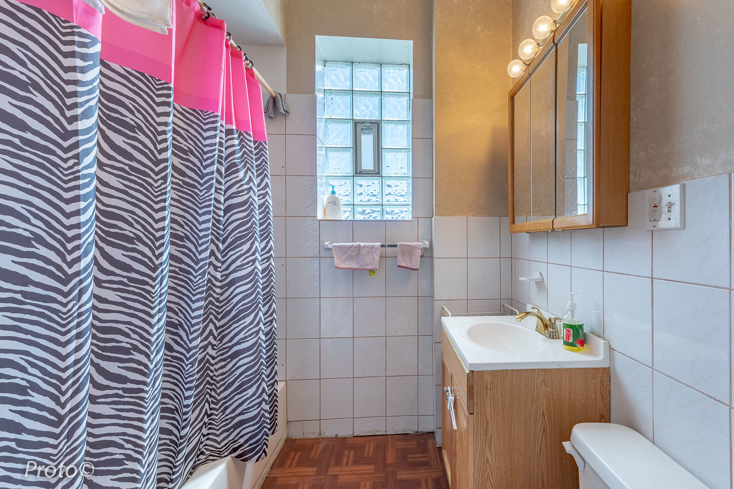 3605 West Cermak Road Chicago, IL 60623 - Photo 21 of 41 a bathroom with a sink and a shower