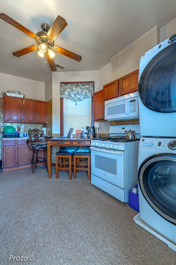 3605 West Cermak Road Chicago, IL 60623 - Photo 24 of 41 a kitchen with a sink and a stove top oven
