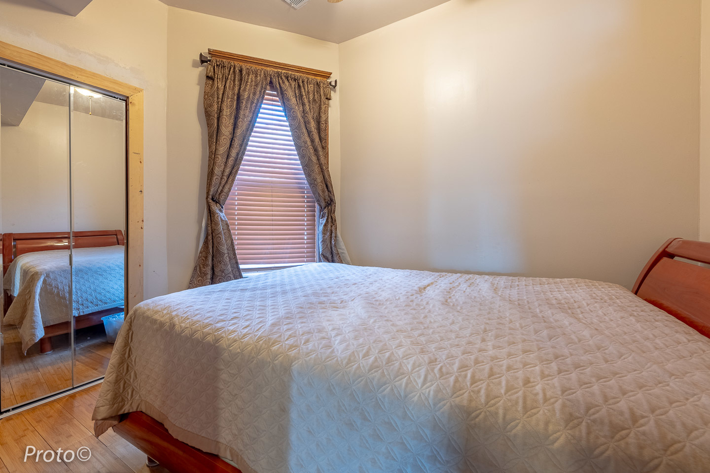 3605 West Cermak Road Chicago, IL 60623 - Photo 25 of 41 a bedroom with a bed and wooden floor