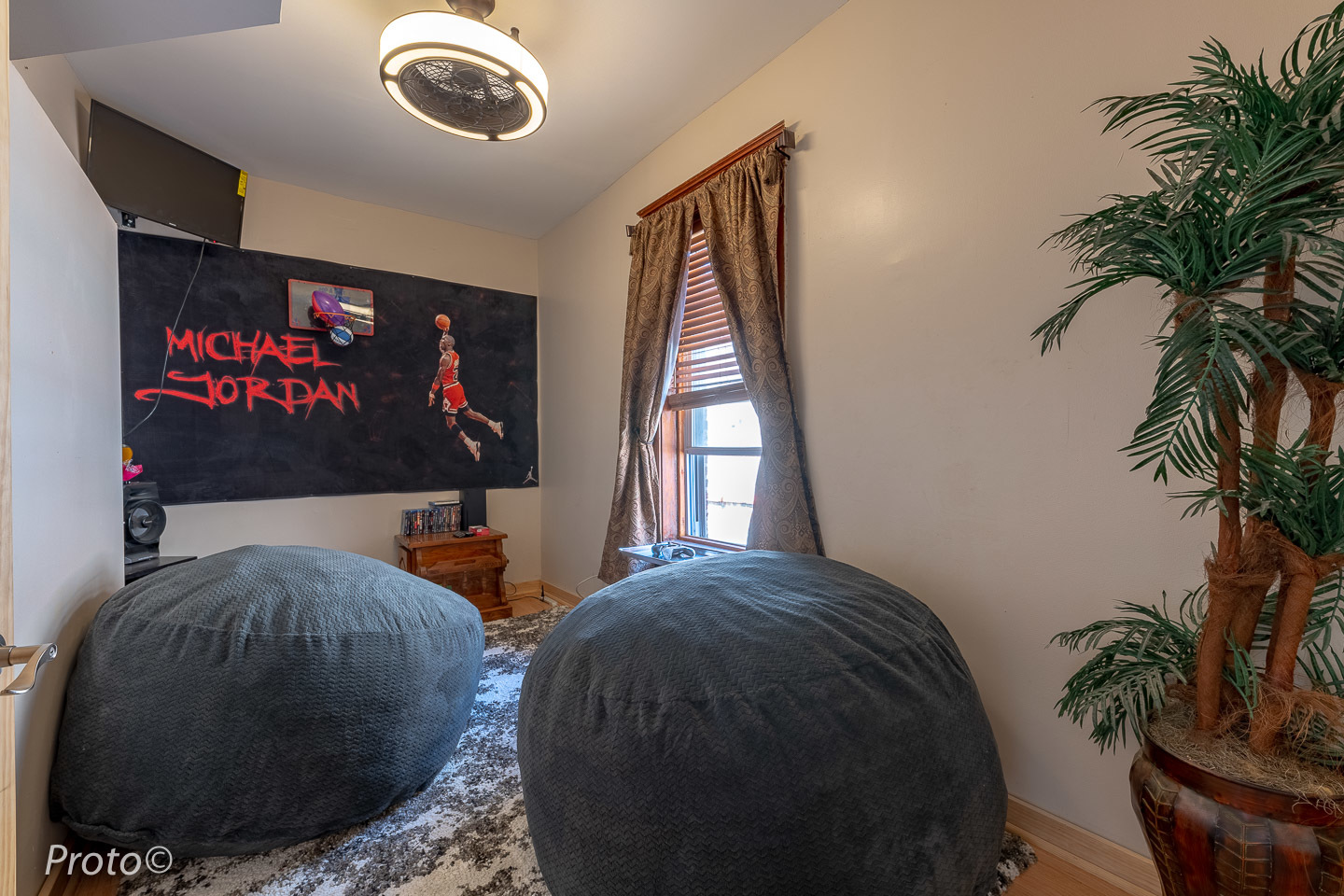 3605 West Cermak Road Chicago, IL 60623 - Photo 26 of 41 a bed room with a bed and a potted plant