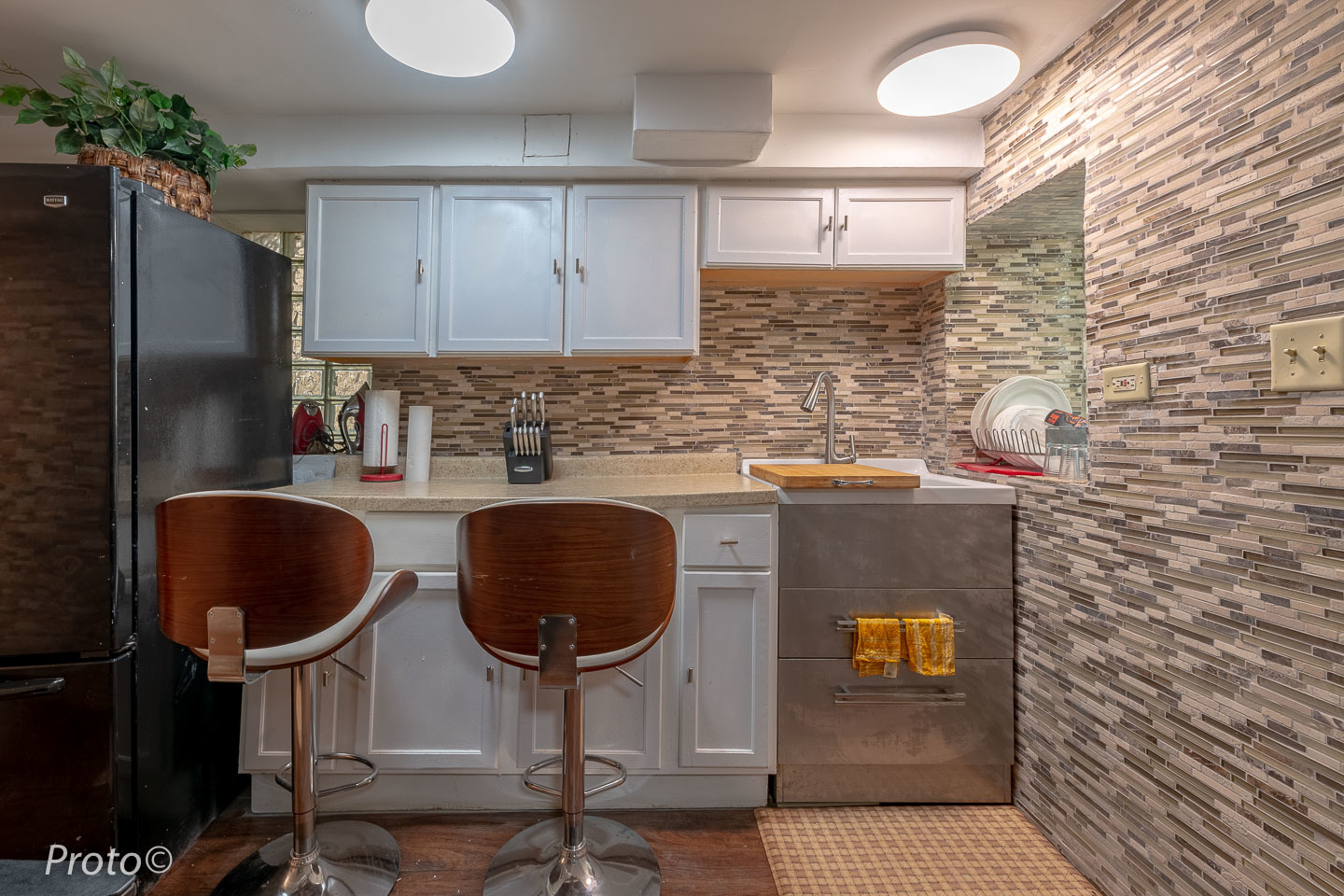 3605 West Cermak Road Chicago, IL 60623 - Photo 31 of 41 a kitchen with granite countertop a sink a stove and a refrigerator