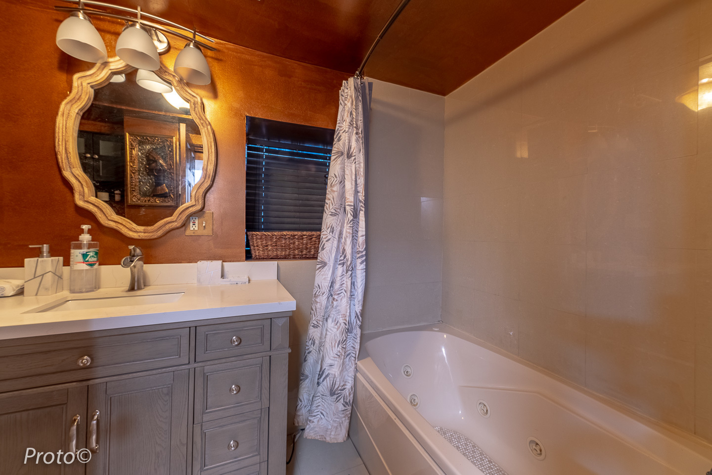 3605 West Cermak Road Chicago, IL 60623 - Photo 33 of 41 a bathroom with a sink and a mirror