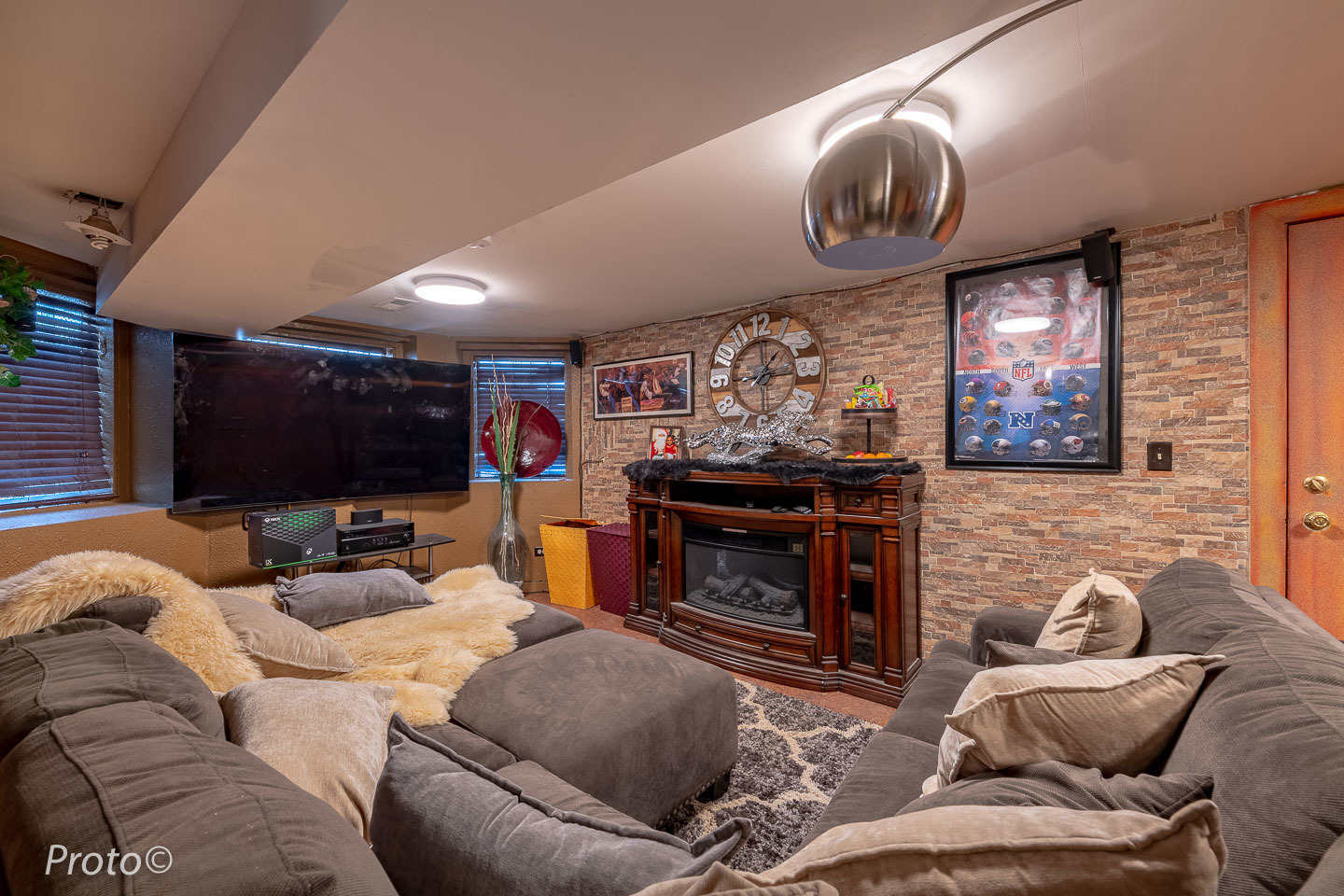 3605 West Cermak Road Chicago, IL 60623 - Photo 38 of 41 a living room with furniture a flat screen tv and a fireplace