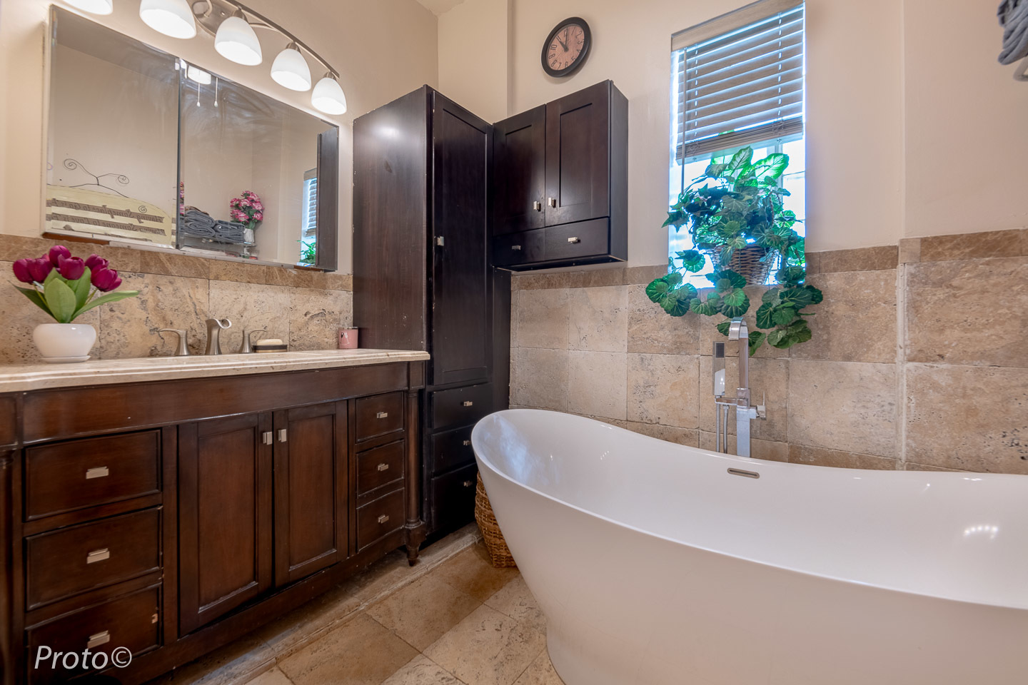 3605 West Cermak Road Chicago, IL 60623 - Photo 10 of 41 a bathroom with a tub sink and mirror