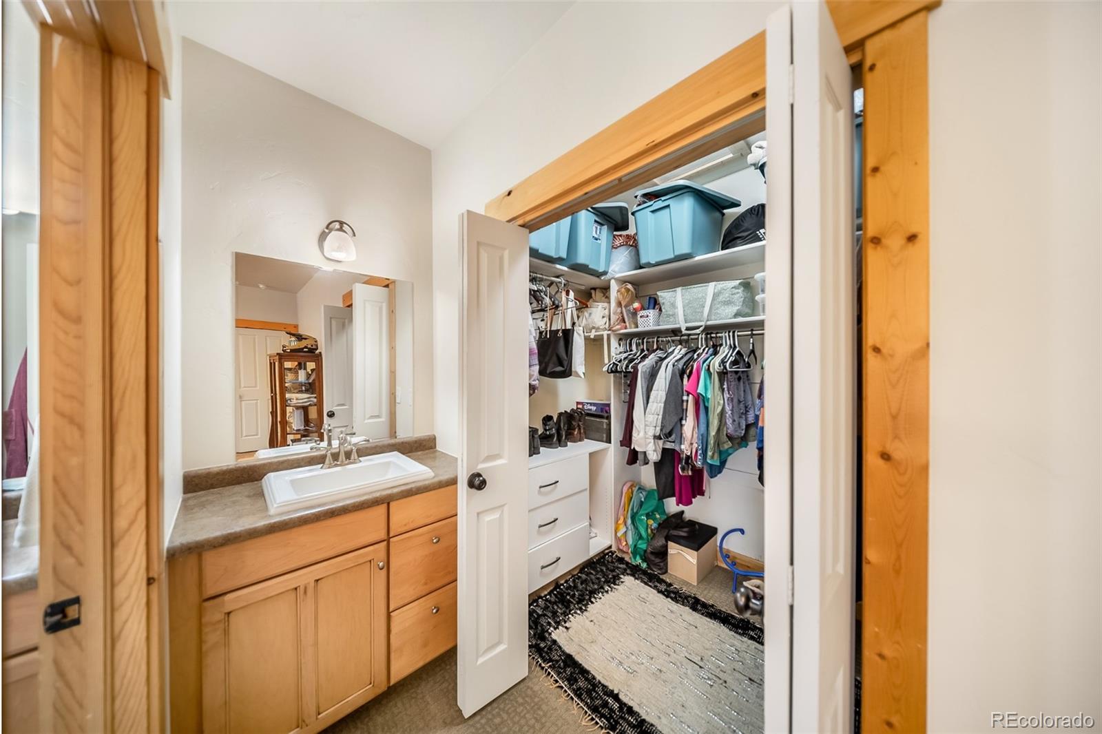 143 East Grand Avenue Hot Sulphur Springs, CO 80451 - Photo 13 of 37 a view of walk in closet with clothes and shoes