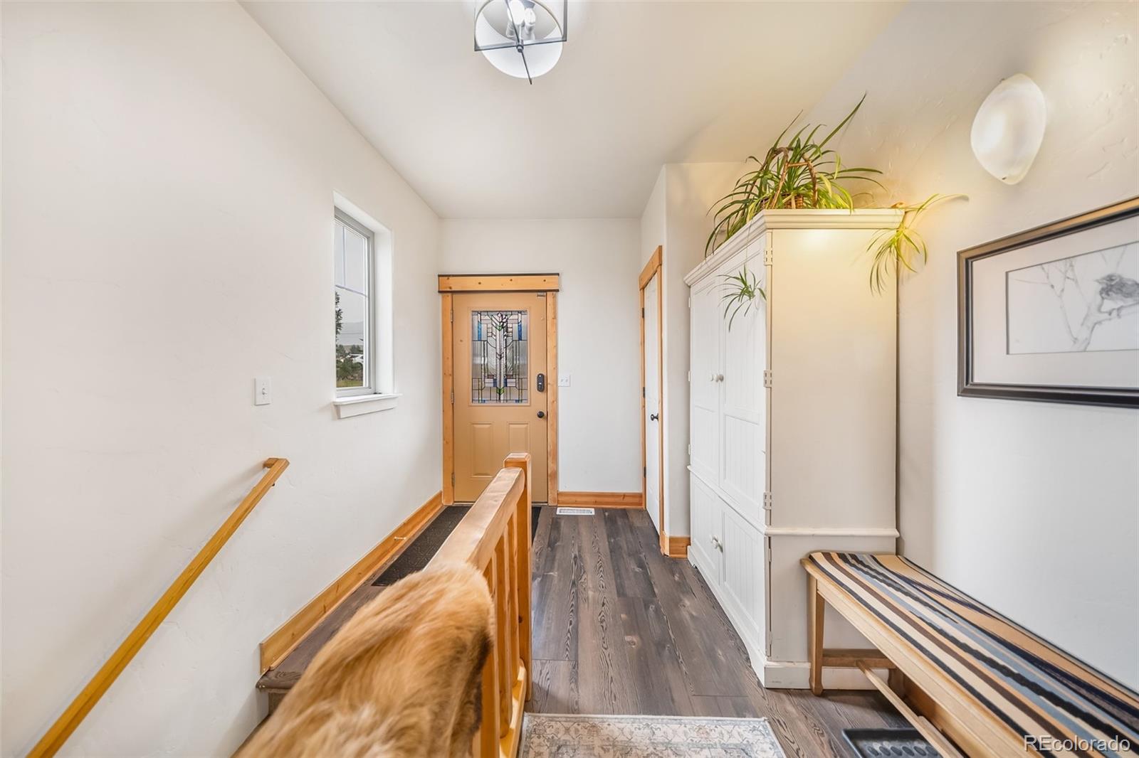 143 East Grand Avenue Hot Sulphur Springs, CO 80451 - Photo 19 of 37 a view of a hallway with furniture and a window