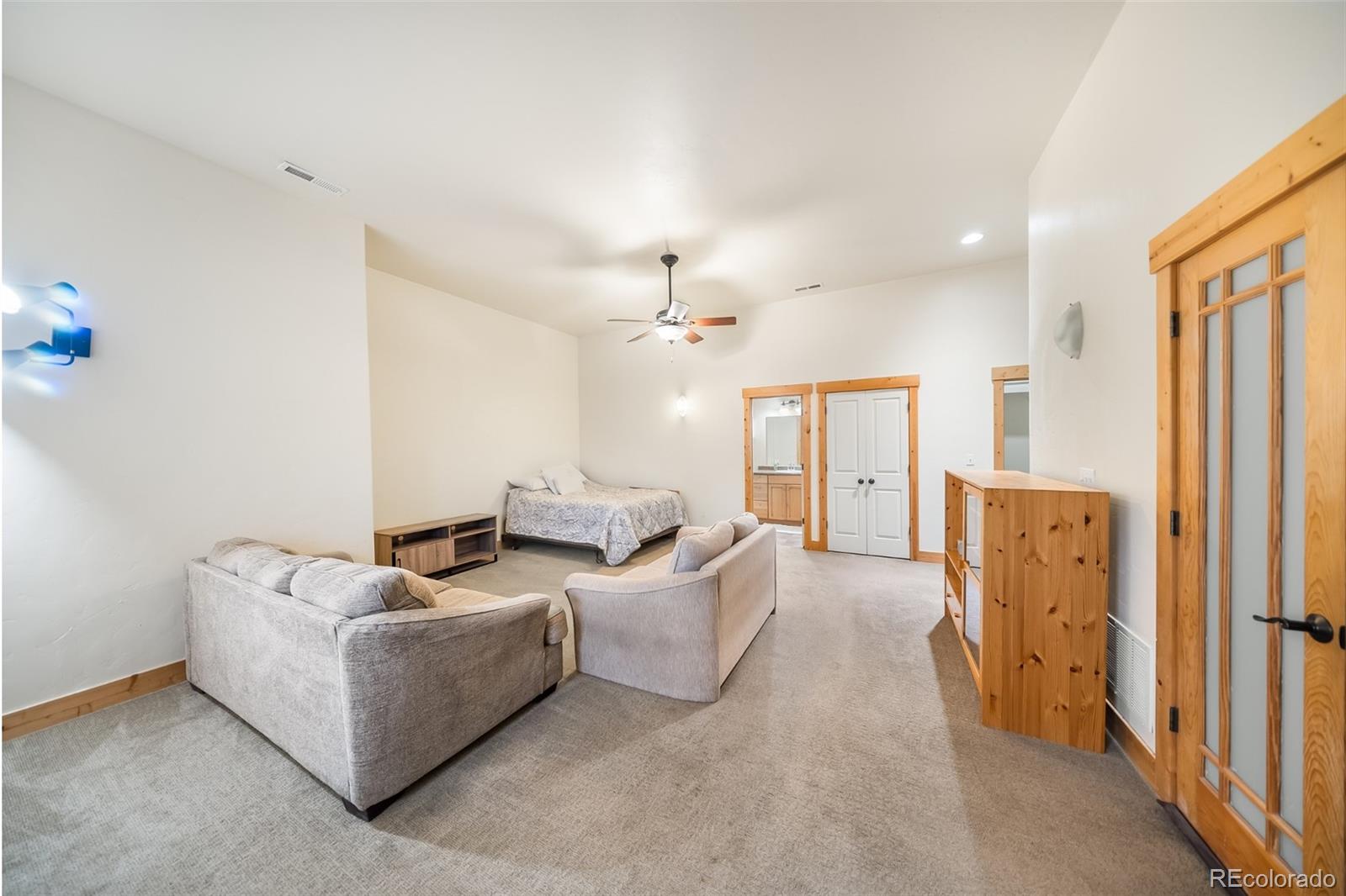 143 East Grand Avenue Hot Sulphur Springs, CO 80451 - Photo 21 of 37 a living room with furniture and a chandelier