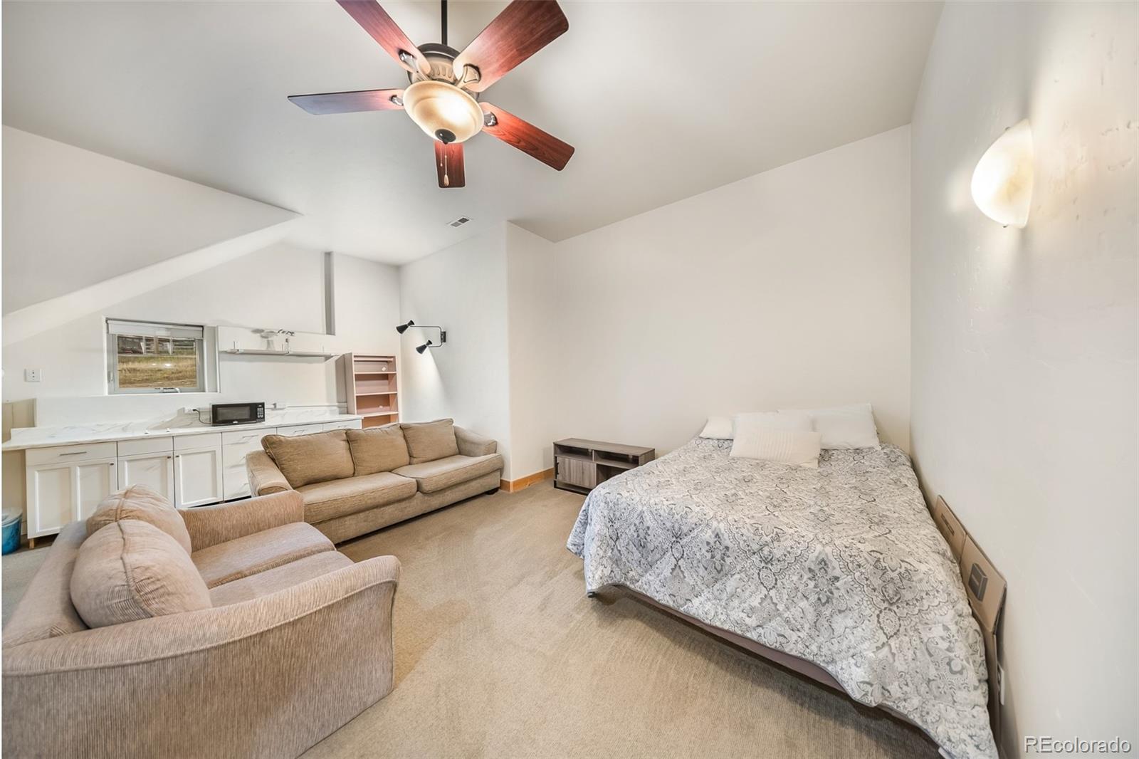 143 East Grand Avenue Hot Sulphur Springs, CO 80451 - Photo 22 of 37 a living room with furniture and a ceiling fan
