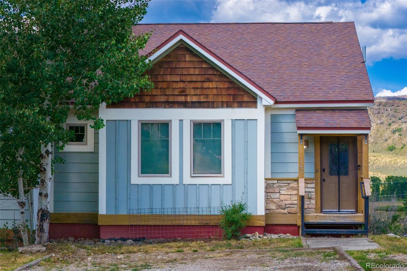 143 East Grand Avenue Hot Sulphur Springs, CO 80451 - Photo 29 of 37 a view of a house with a yard