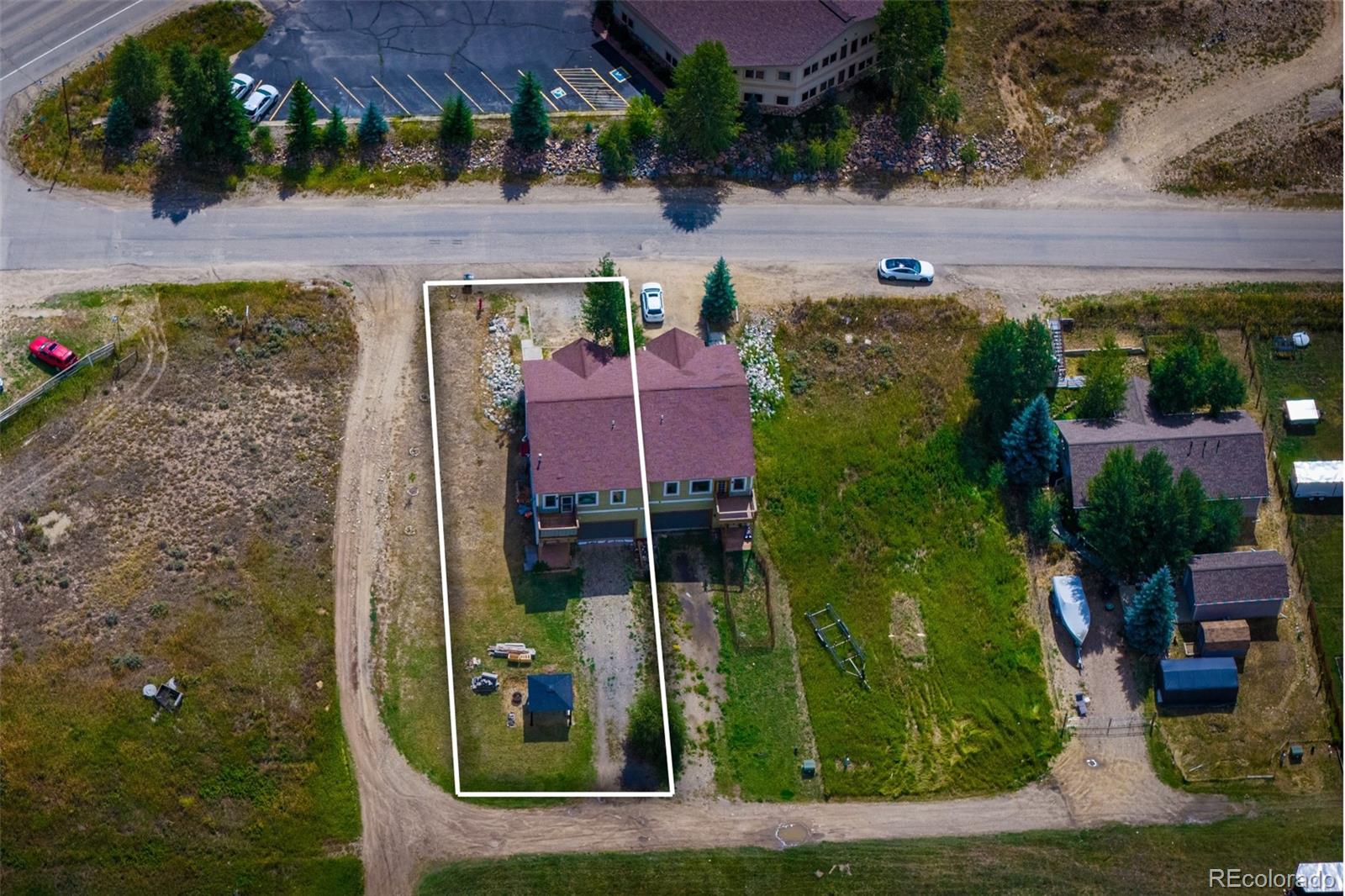 143 East Grand Avenue Hot Sulphur Springs, CO 80451 - Photo 33 of 37 an aerial view of a house with a yard basket ball court and outdoor seating