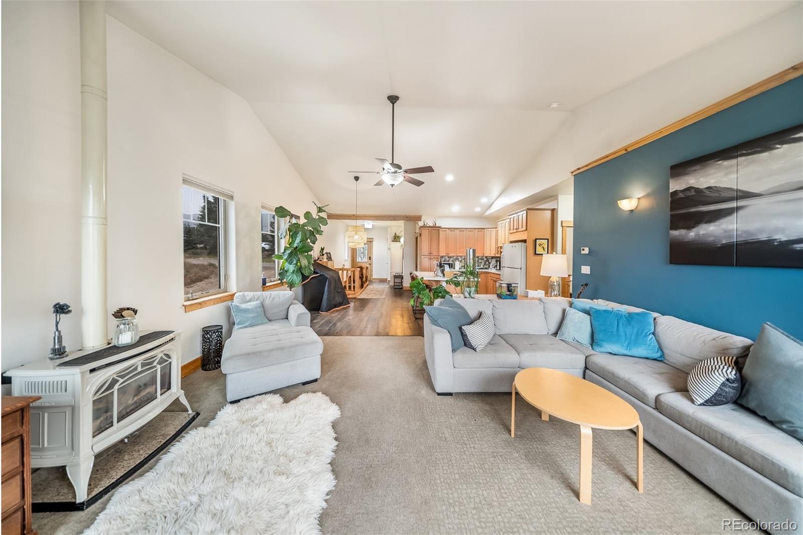 143 East Grand Avenue Hot Sulphur Springs, CO 80451 - Photo 5 of 37 a living room with furniture kitchen view and a chandelier