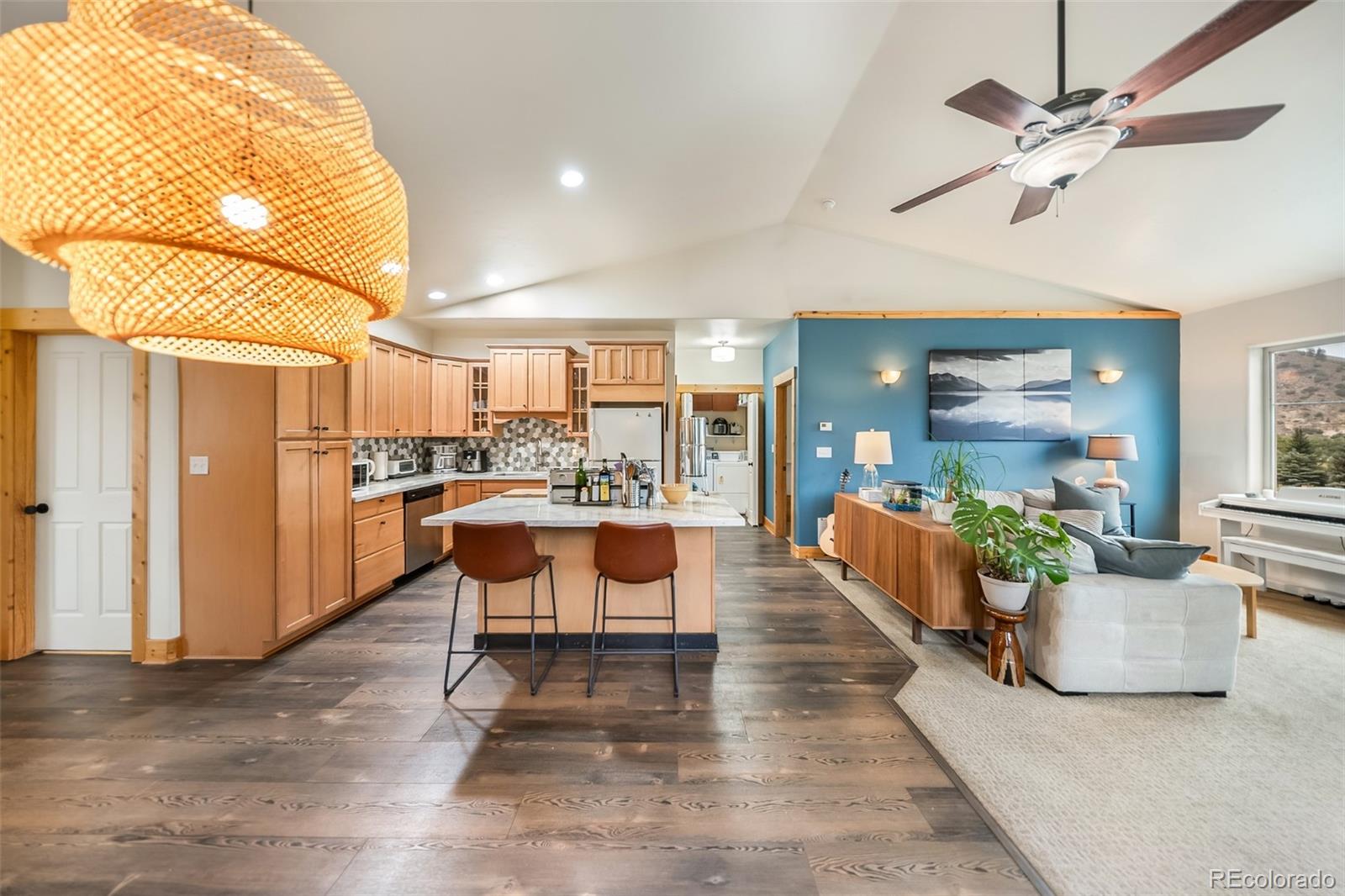 143 East Grand Avenue Hot Sulphur Springs, CO 80451 - Photo 7 of 37 a room with stainless steel appliances kitchen island granite countertop furniture and a rug