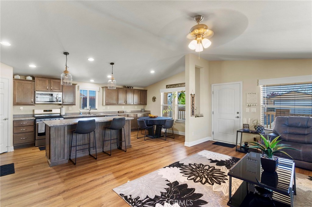 22241 Nisqually Road, Unit 103 Apple Valley, CA 92308 - Photo 2 of 34 Open kitchen with large island flowing into living room.