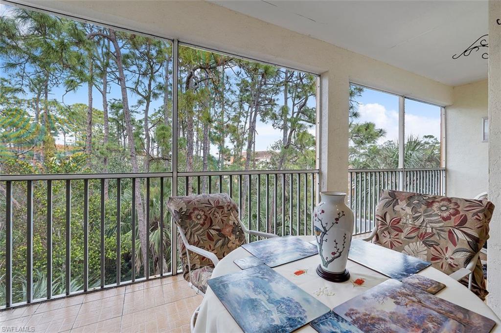 4500 Botanical Pl Circle, Unit 404 Naples, FL 34112 - Photo 17 of 31 View of sunroom