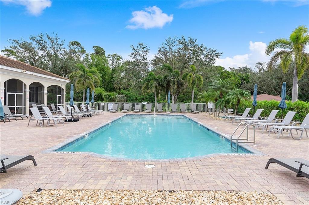 4500 Botanical Pl Circle, Unit 404 Naples, FL 34112 - Photo 24 of 31 View of pool with a patio area