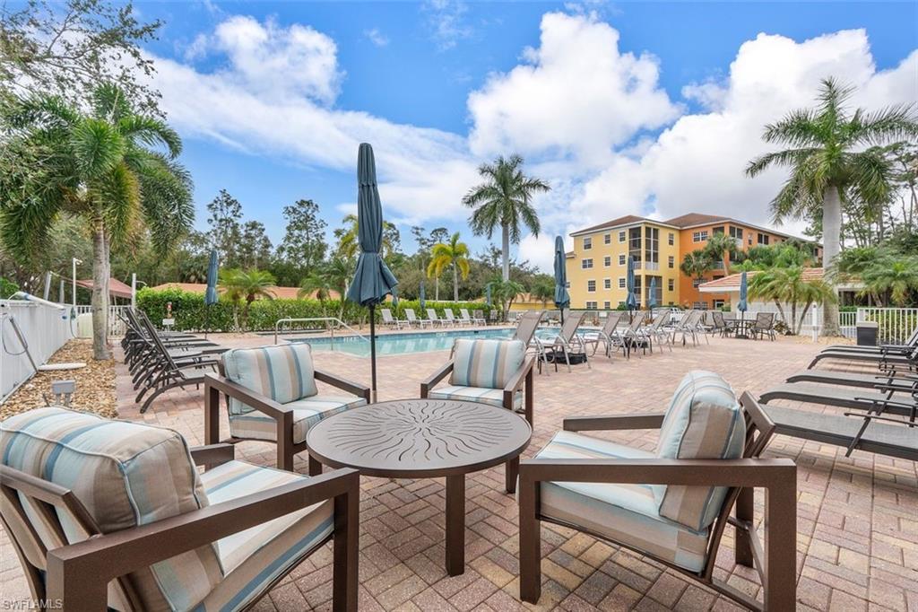 4500 Botanical Pl Circle, Unit 404 Naples, FL 34112 - Photo 29 of 31 View of patio / terrace with a community pool