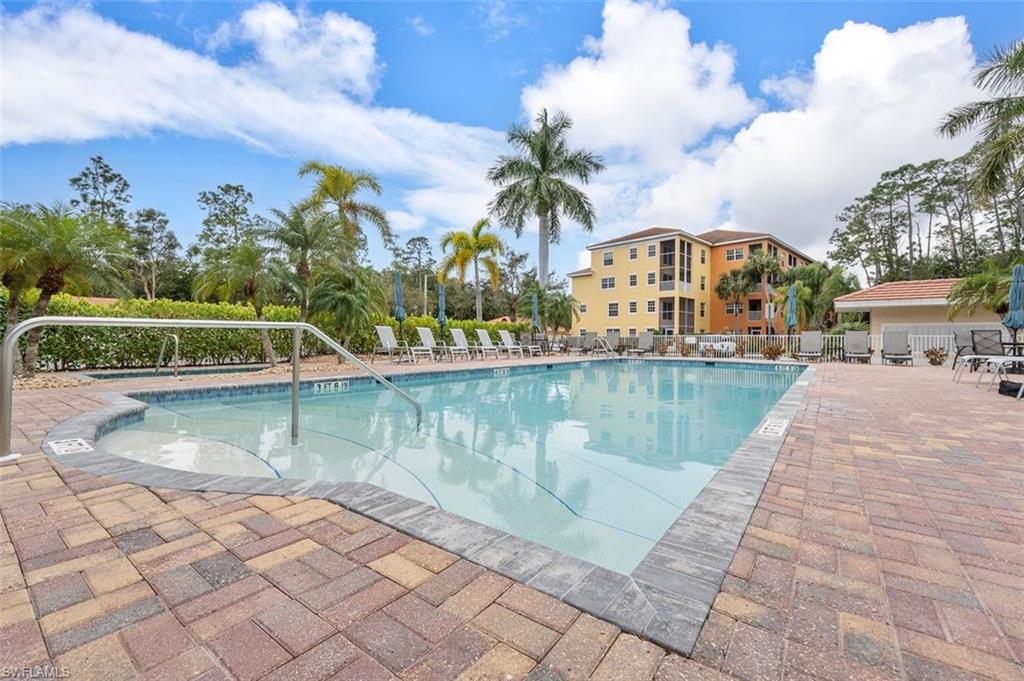 4500 Botanical Pl Circle, Unit 404 Naples, FL 34112 - Photo 30 of 31 View of swimming pool featuring a patio