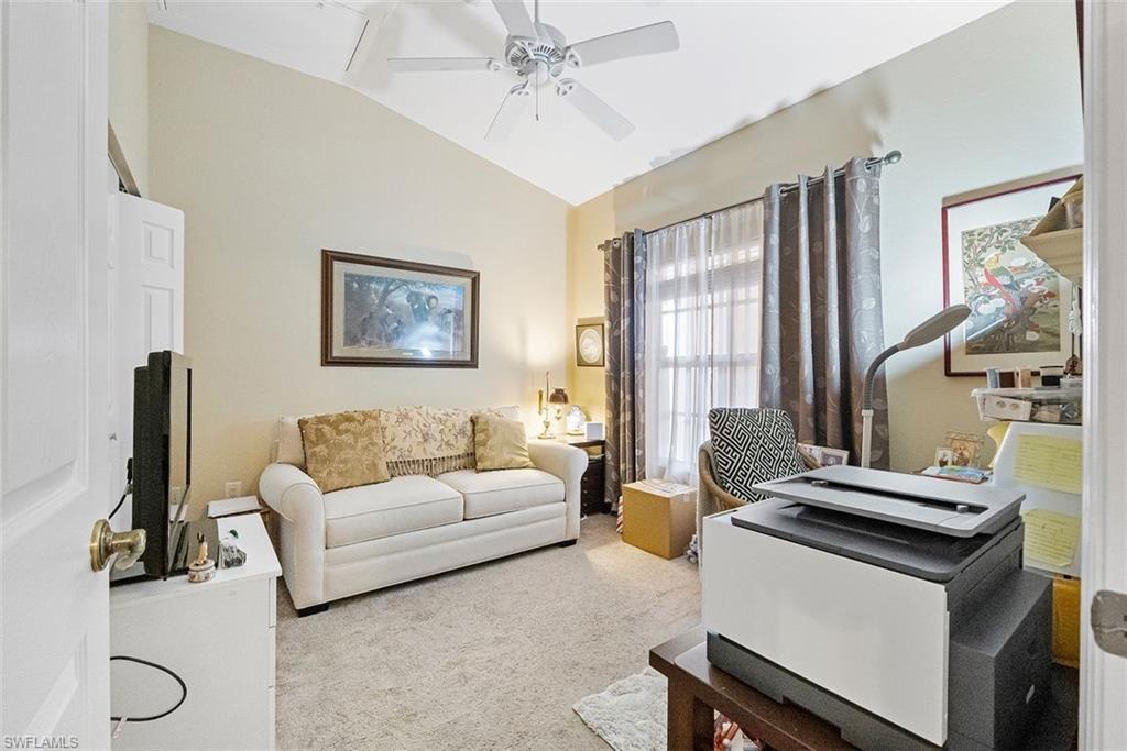 4500 Botanical Pl Circle, Unit 404 Naples, FL 34112 - Photo 8 of 31 Carpeted home office with ceiling fan and vaulted ceiling