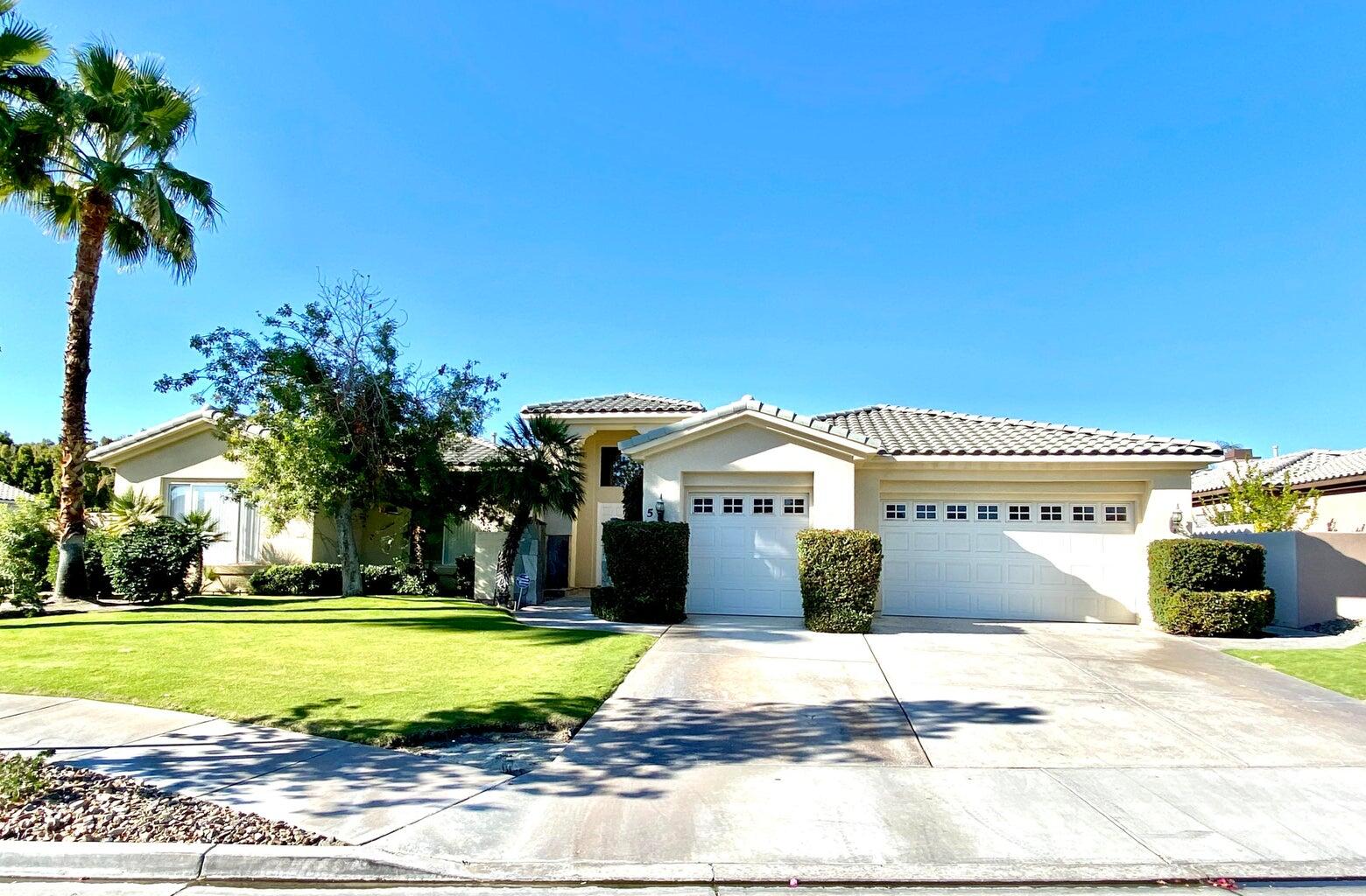 5 Victoria Falls Drive Rancho Mirage, CA 92270 - Photo 11 of 26 a front view of a house with a yard