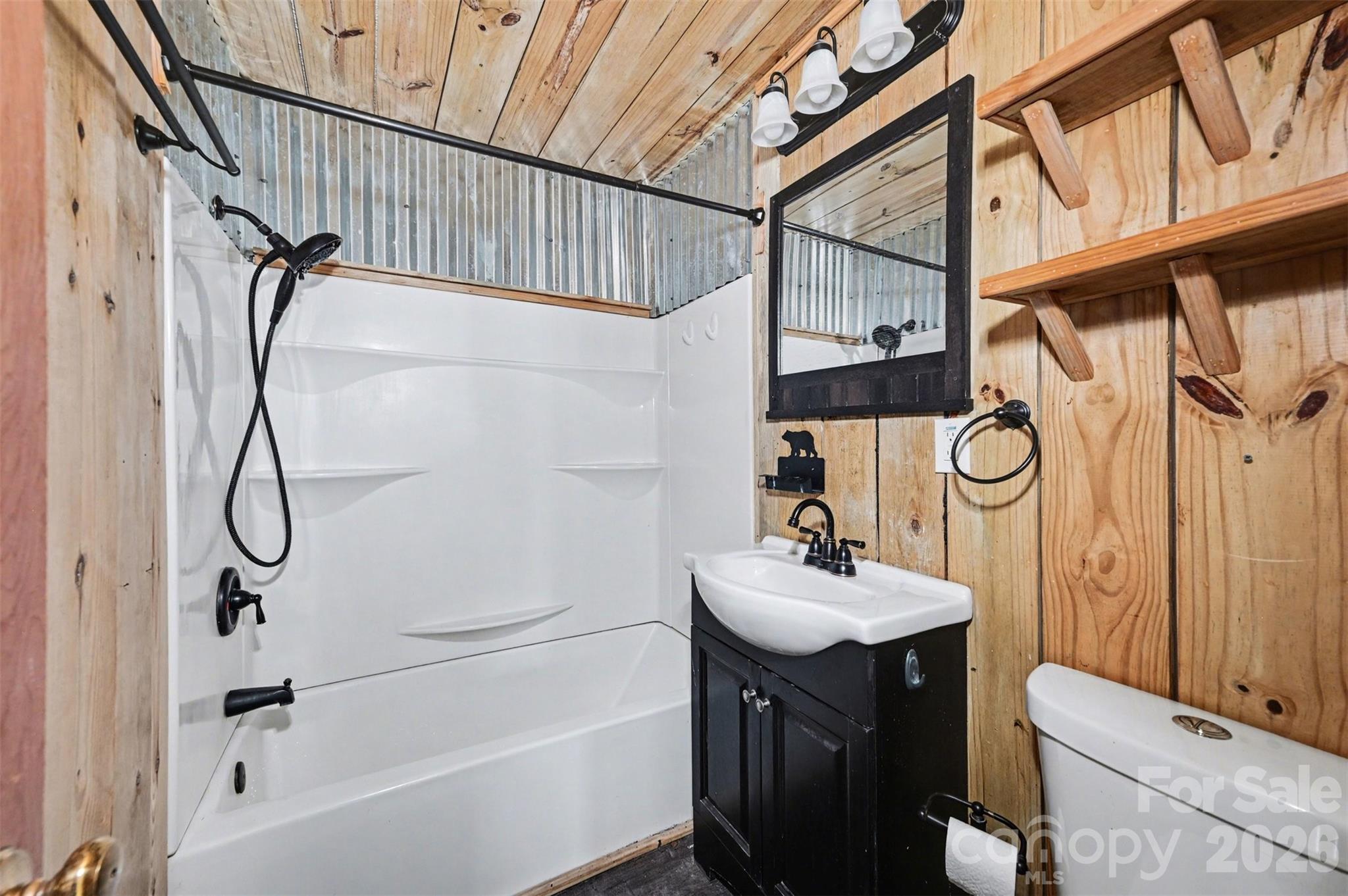 5495 Pine Ridge Drive Connelly Springs, NC 28612 - Photo 13 of 17 a bathroom with a sink a toilet and shower