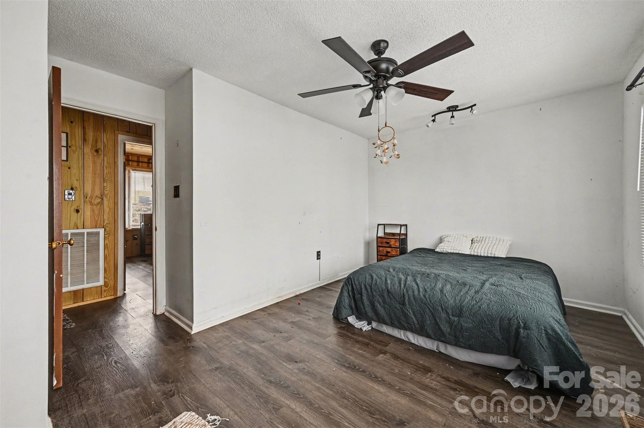 5495 Pine Ridge Drive Connelly Springs, NC 28612 - Photo 15 of 17 a bedroom with a bed and a ceiling fan