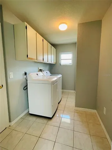 a utility room with a sink washer and dryer