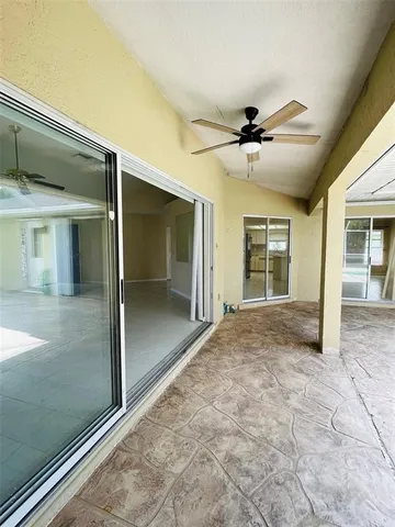 a view of a hallway with a chandelier