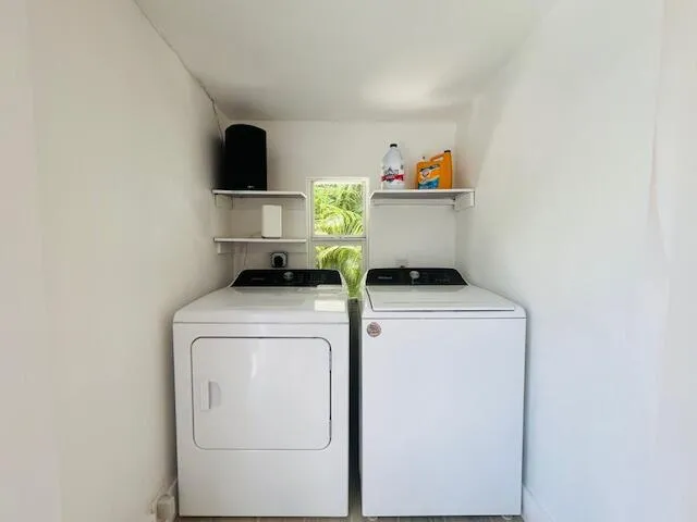 a utility room with dryer and washer