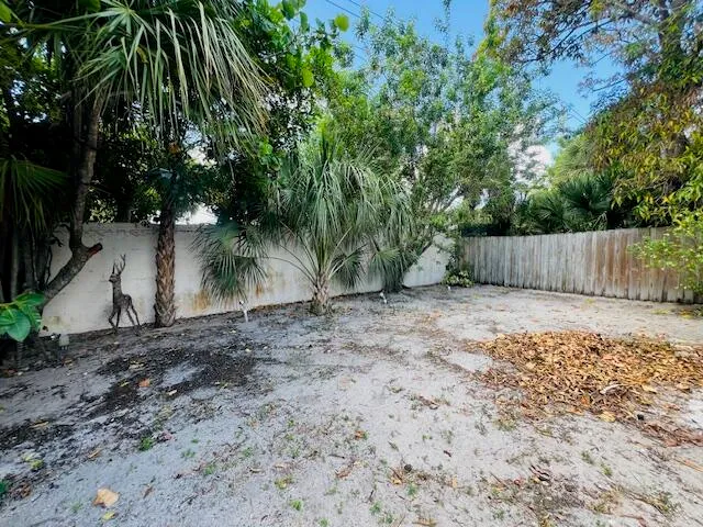 a backyard of a house with wooden floor
