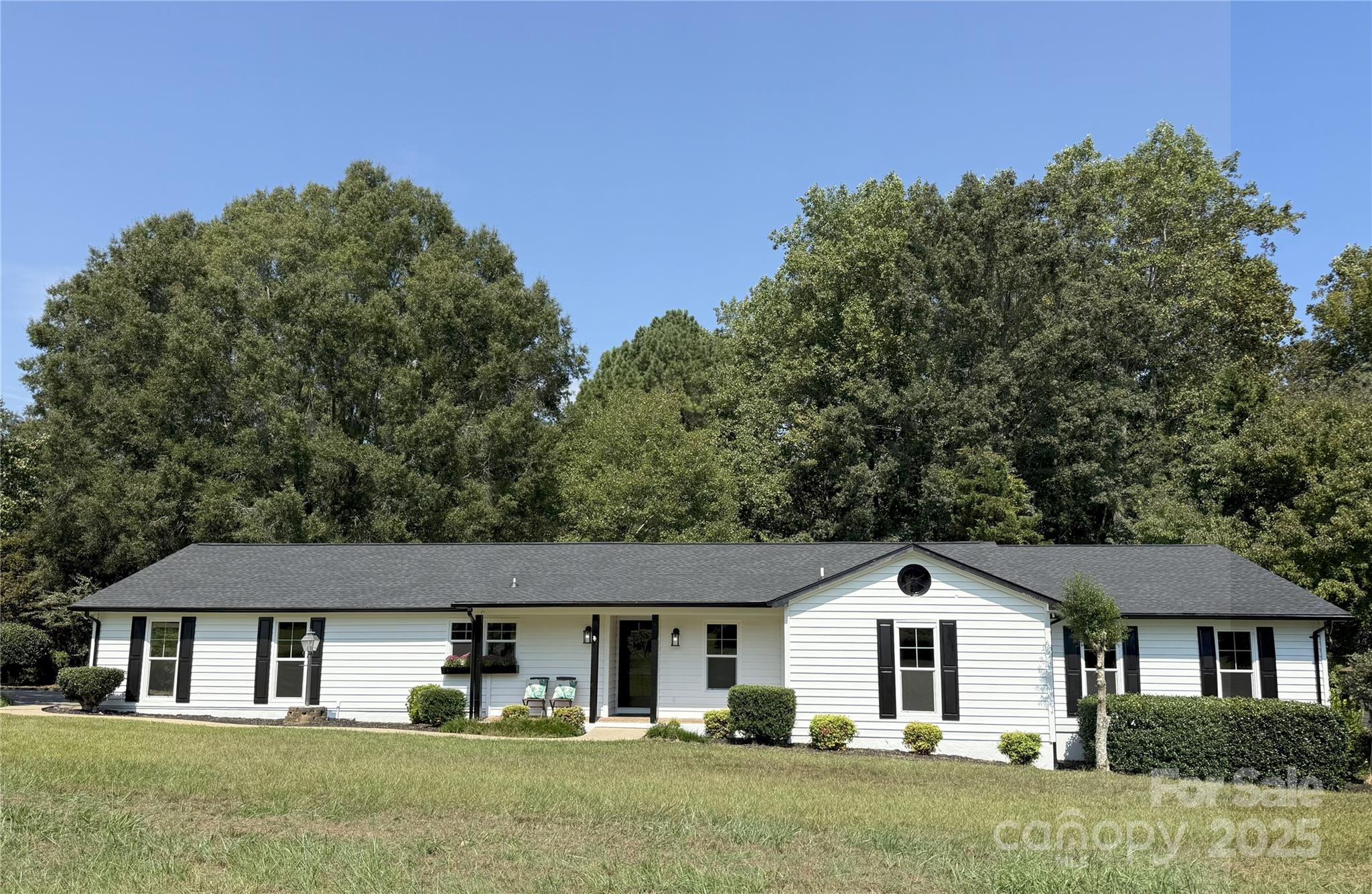 7109 Forney Hill Road Denver, NC 28037 - Photo 1 of 45 a front view of a house with a yard