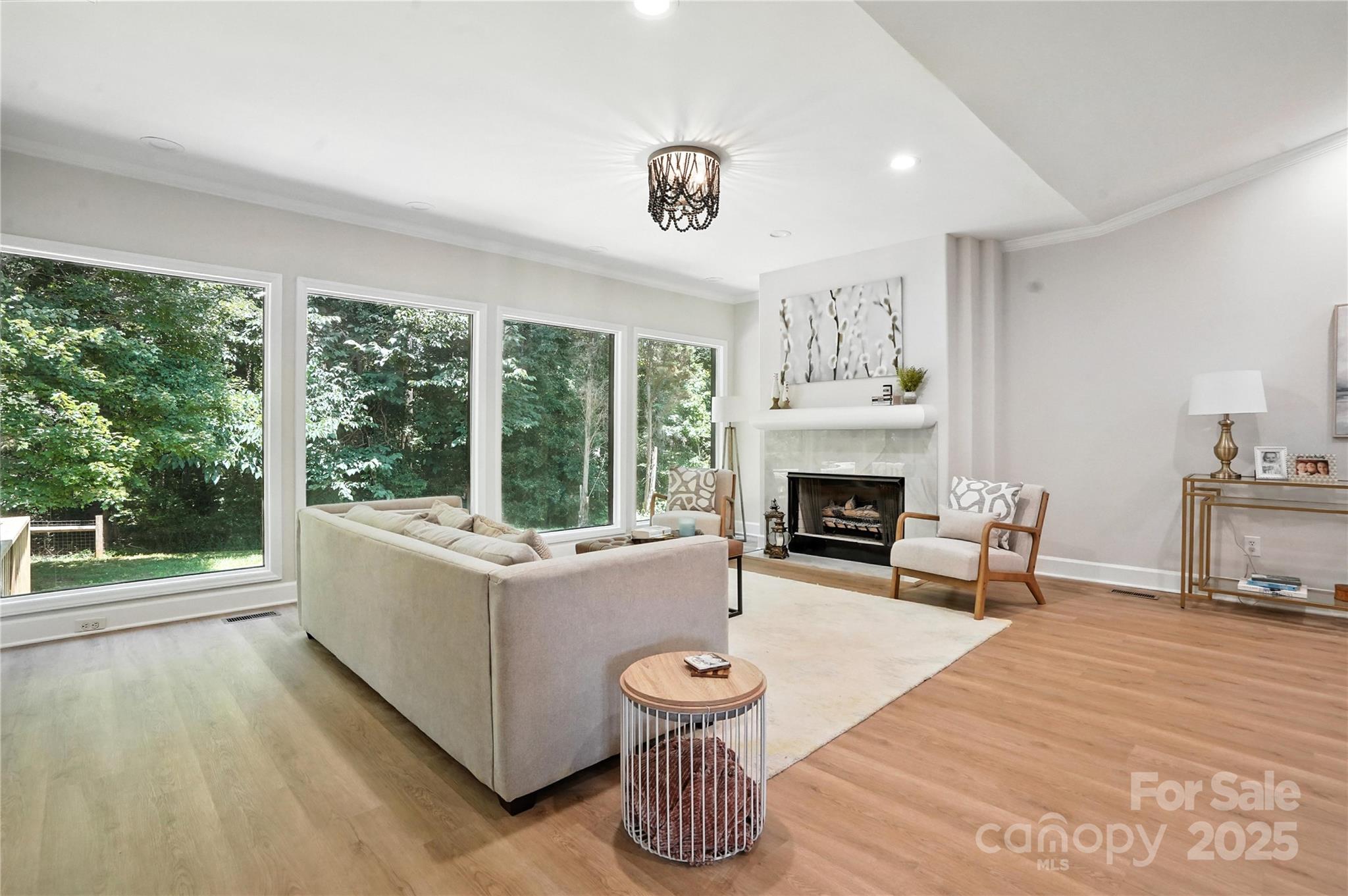 7109 Forney Hill Road Denver, NC 28037 - Photo 12 of 45 a living room with furniture and a fireplace