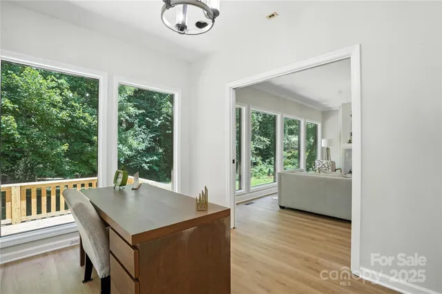 a view of a dining room with furniture window and outside view