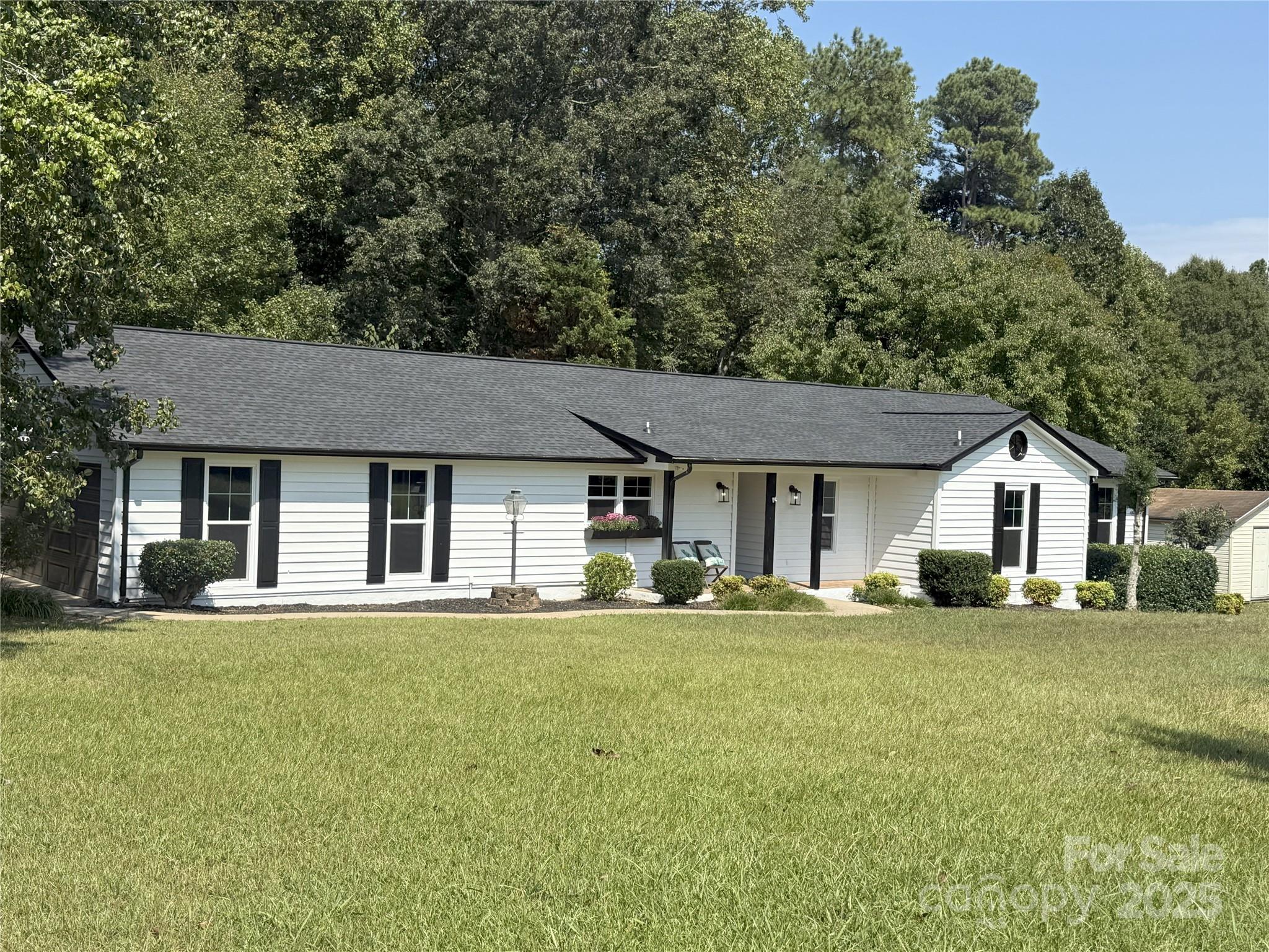 7109 Forney Hill Road Denver, NC 28037 - Photo 2 of 45 front view of a house with a yard